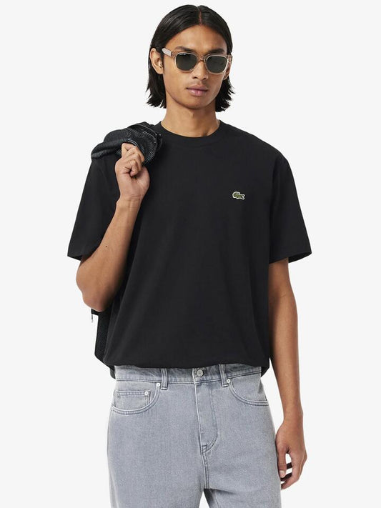 Image of a model wearing Tops. Productname: Lacoste Essential Classic Fit T-Shirt in Black colour by brand - Lacoste