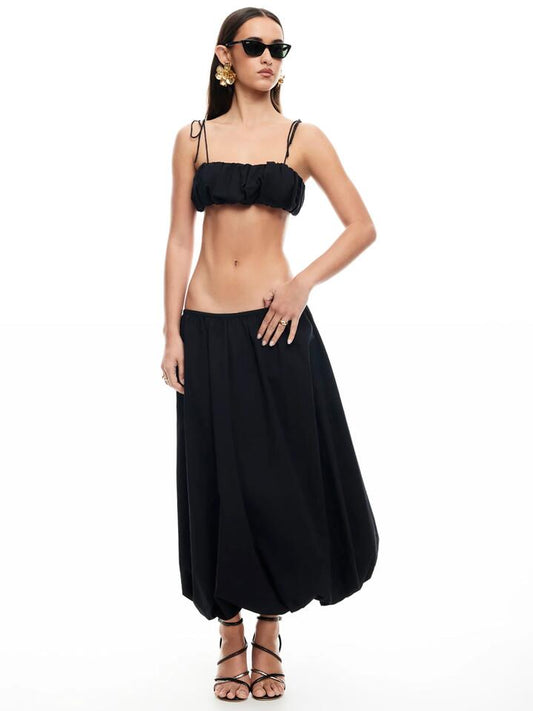 Image of a model wearing Skirts. Productname: Lioness Intuition Bubble Midi Skirt in Onyx colour by brand - Lioness