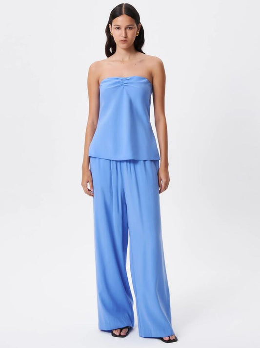 Image of a model wearing Tops. Productname: Lulu & Rose Meg Strapless Top in Cornflower colour by brand - Lulu & Rose