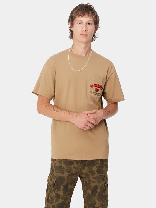 Image of a model wearing Tops. Productname: Carhartt Wip Super Tired T-Shirt in Peanut colour by brand - Carhartt Wip