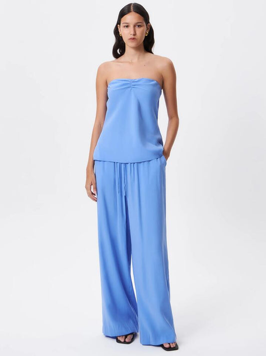 Image of a model wearing Pants. Productname: Lulu & Rose Meg Drawstring Pant in Cornflower colour by brand - Lulu & Rose