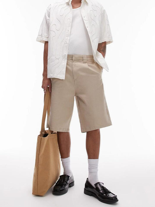 Image of a model wearing Pants. Productname: Topman Wide Chino Shorts in Stone colour by brand - Topman