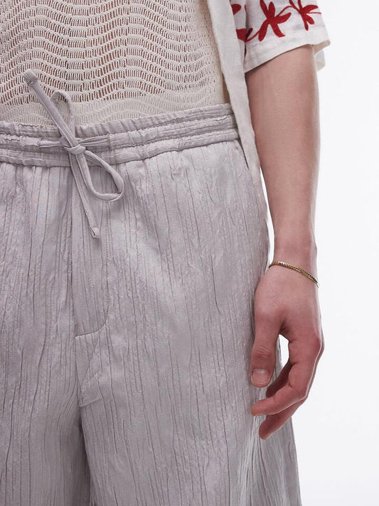 Image of a model wearing Pants. Productname: Topman Premium Wide Leg Textured Trousers in Stone colour by brand - Topman