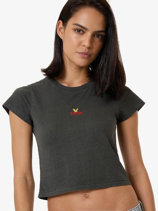 Image of a model wearing Tops. Productname: Thrills Never Stop Mini Tee in MERCH BLACK colour by brand - Thrills