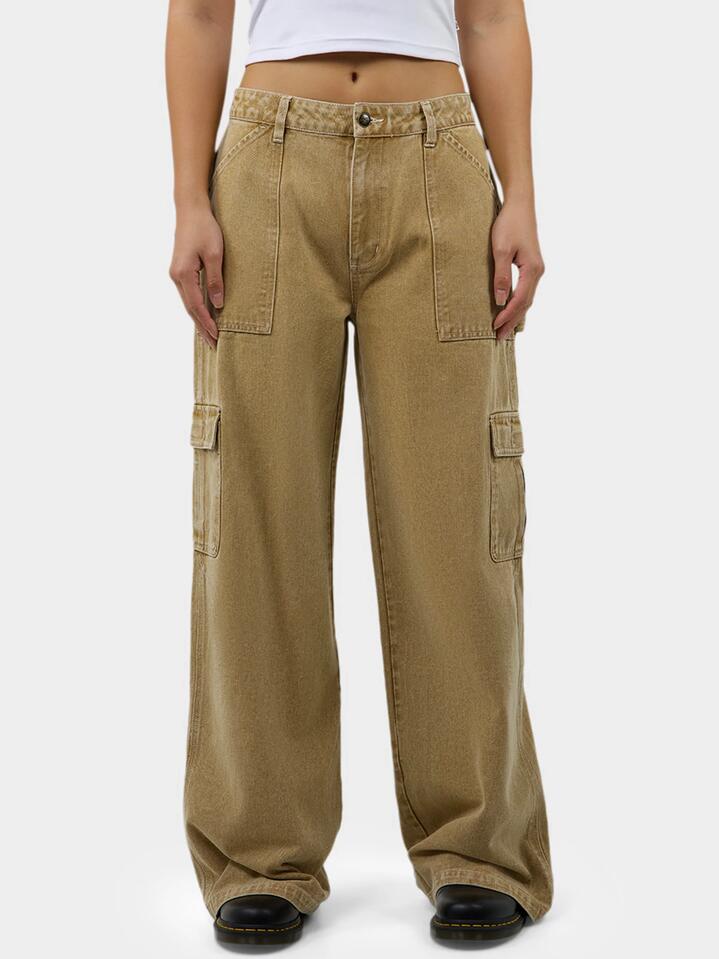 Image of a model wearing Pants. Productname: Dickies Voss Utility Pants in Stone Wash Desert Sand colour by brand - Dickies