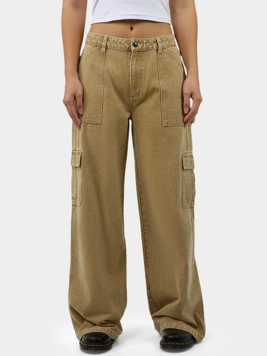 Image of a model wearing Pants. Productname: Dickies Voss Utility Pants in Stone Wash Desert Sand colour by brand - Dickies