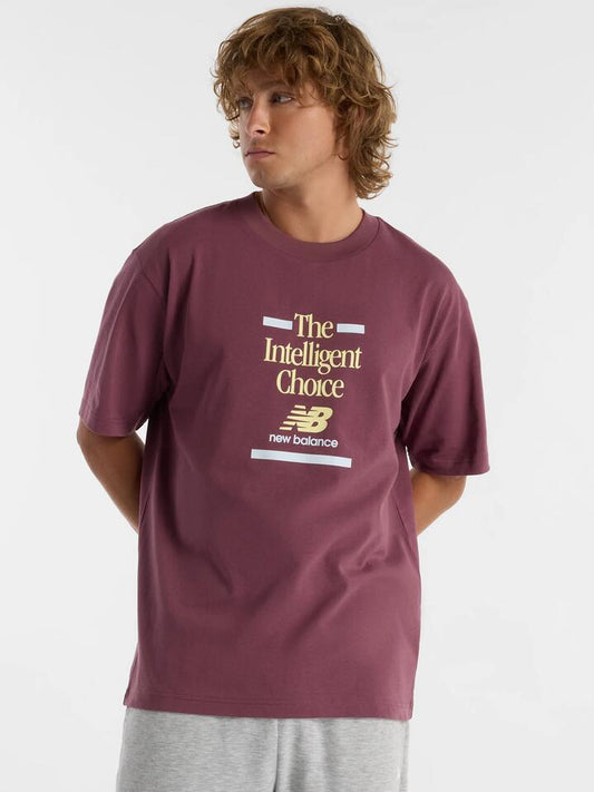 Image of a model wearing Tops. Productname: New Balance Athletics Relaxed Choice Tee in Faded Plum colour by brand - New Balance