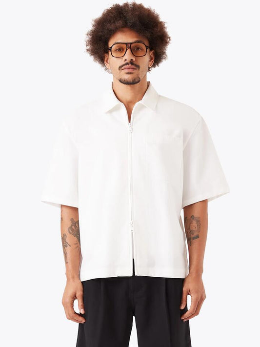 Image of a model wearing Outerwear. Productname: Zanerobe Boxy Overshirt in Vintage White colour by brand - Zanerobe