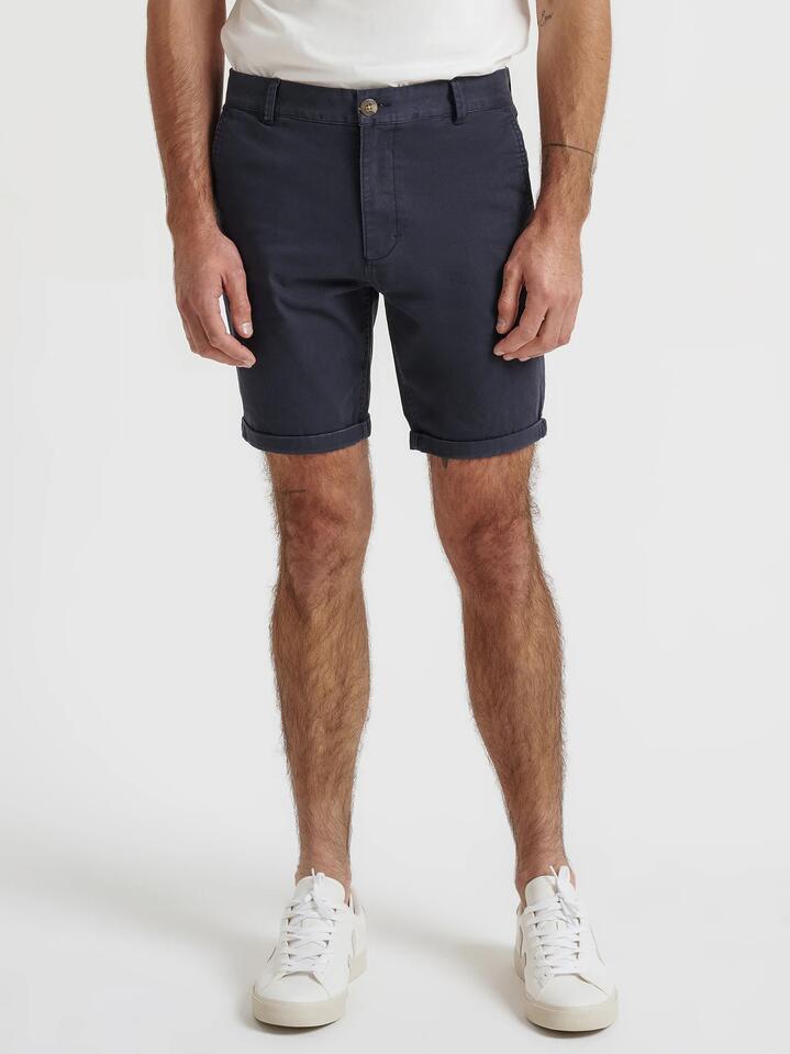 Image of a model wearing Pants. Productname: Article One Ellis Chino Shorts in Navy colour by brand - Article One