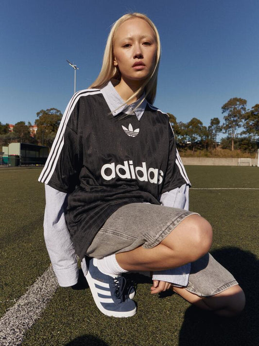 Image of a model wearing Tops. Productname: Adidas Adicolor T-Shirt in Black/White colour by brand - Adidas