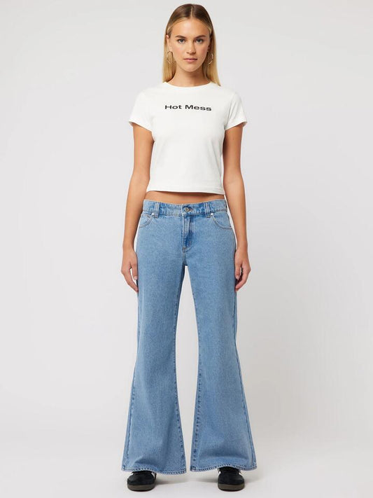 Image of a model wearing Denim. Productname: Abrand 99 Low Baggy Flare Gigi in Mid Blue colour by brand - Abrand