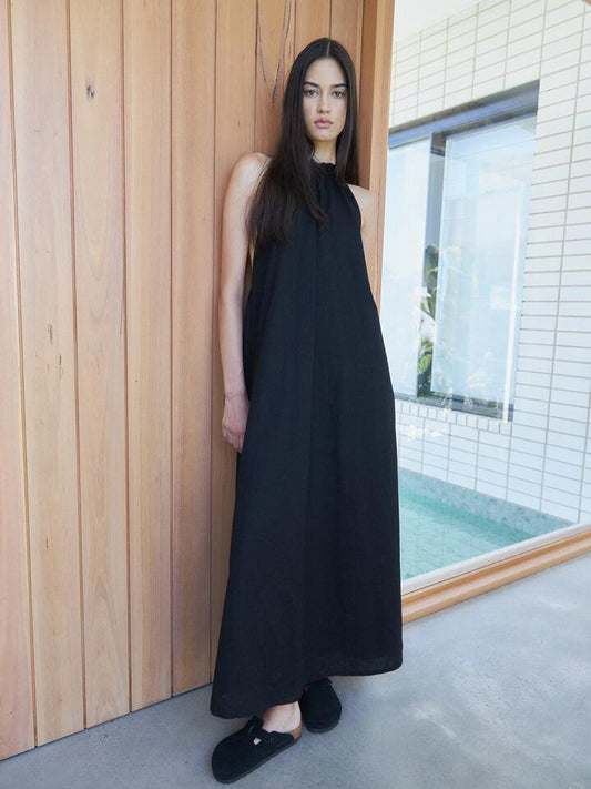 Image of a model wearing Dress. Productname: SNDYS Alysse Halter Dress in Black colour by brand - SNDYS
