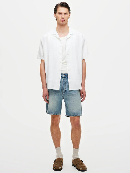 Image of a model wearing Shorts. Productname: Neuw River Short Cortez in Light Vintage Indigo colour by brand - Neuw