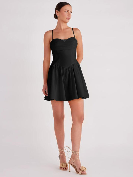 Image of a model wearing Dress. Productname: SNDYS Elsie Mini Dress in Black colour by brand - SNDYS