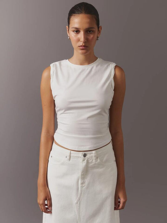 Image of a model wearing Tops. Productname: MSE Curved Hem Tank Top in Off White colour by brand - MSE