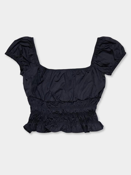 Image of a model wearing Tops. Productname: Lulu & Rose Penelope Shirred Top in Black colour by brand - Lulu & Rose