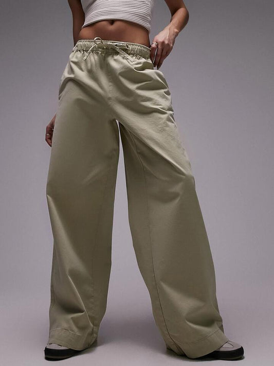 Image of a model wearing Pants. Productname: Topshop Casual Draw Cord Waist Straight Leg Trouser in STONE colour by brand - Topshop