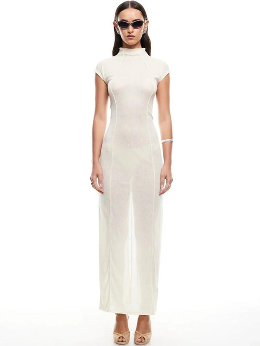 Image of a model wearing Dress. Productname: Lioness Redefined Maxi Dress in Cream colour by brand - Lioness