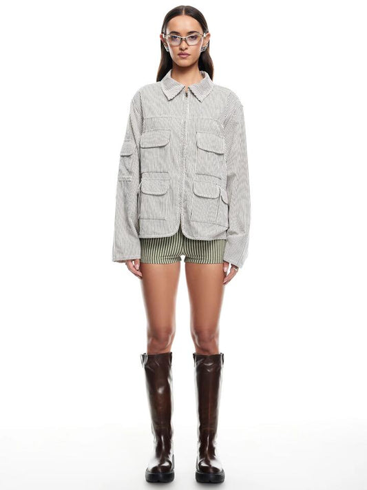 Image of a model wearing Shorts. Productname: Lioness Reborn Mini Short in Sage colour by brand - Lioness