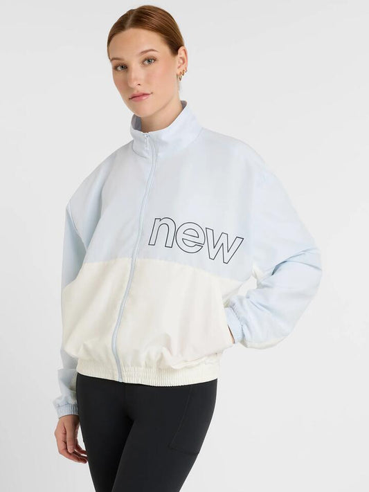Image of a model wearing Outerwear. Productname: New Balance Color Blocked Woven Jacket in Ice Blue colour by brand - New Balance