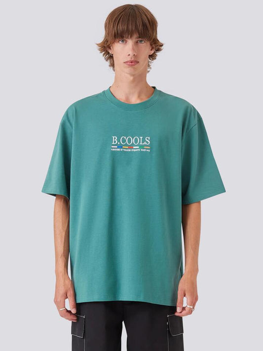 Image of a model wearing Tops. Productname: Barney Cools BRNY Tee in College Green colour by brand - Barney Cools
