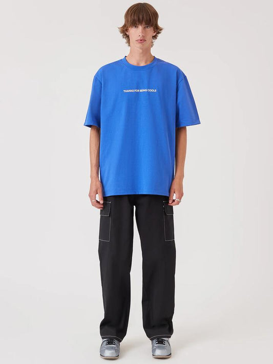Image of a model wearing Tops. Productname: Barney Cools Thanks Tee in Cyber Blue colour by brand - Barney Cools