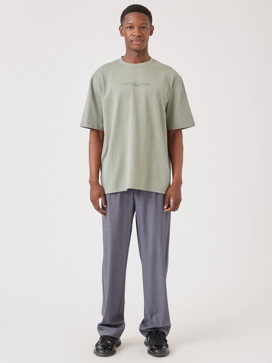 Image of a model wearing Tops. Productname: Barney Cools Vinyl Tee in Thyme colour by brand - Barney Cools