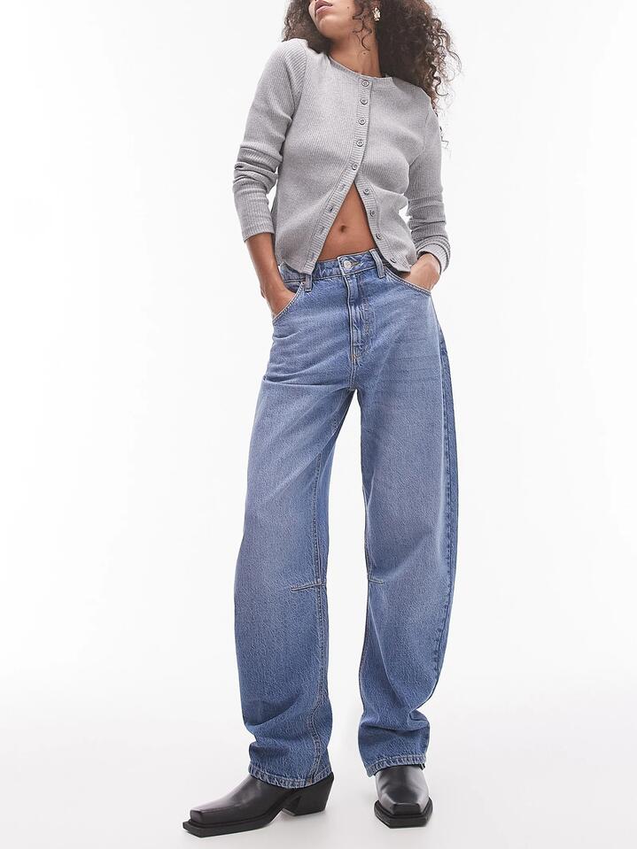 Image of a model wearing Denim. Productname: Topshop Barrel Leg Jeans in MID BLUE colour by brand - Topshop