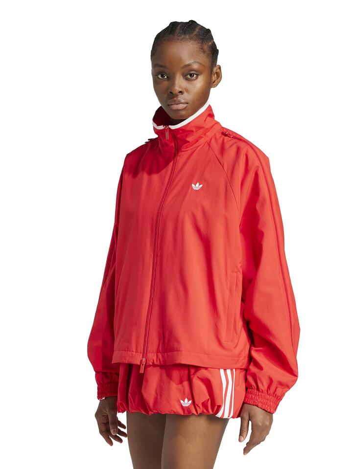 Image of a model wearing Tops. Productname: Adidas Woven Track Top Zip in Better Scarlet colour by brand - Adidas