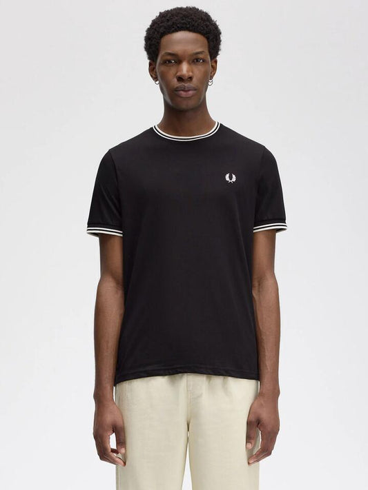 Image of a model wearing Tops. Productname: Fred Perry Twin Tipped T-Shirt in Black colour by brand - Fred Perry