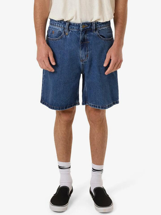 Image of a model wearing Denim. Productname: Thrills Slacker Denim Short in DOUBLE RINSED BLUES colour by brand - Thrills