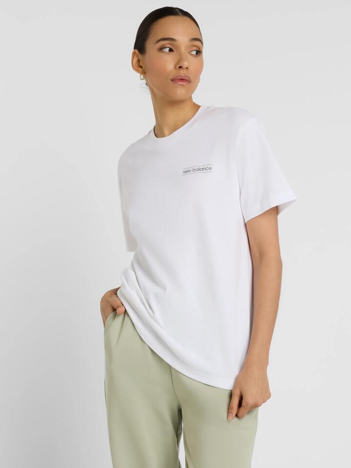 Image of a model wearing Tops. Productname: New Balance Athletics Relaxed System Tee in White colour by brand - New Balance