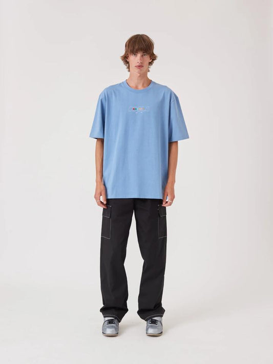 Image of a model wearing Tops. Productname: Barney Cools BRNY Tee in Washed Blue colour by brand - Barney Cools