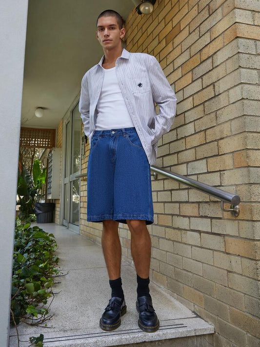 Image of a model wearing Denim. Productname: Xlarge Bull Denim 91 Shorts in Blue Denim colour by brand - Xlarge