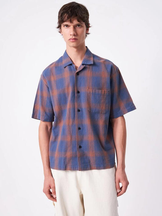 Image of a model wearing Tops. Productname: Article One Porter Boxy Shirt in Blue Check colour by brand - Article One
