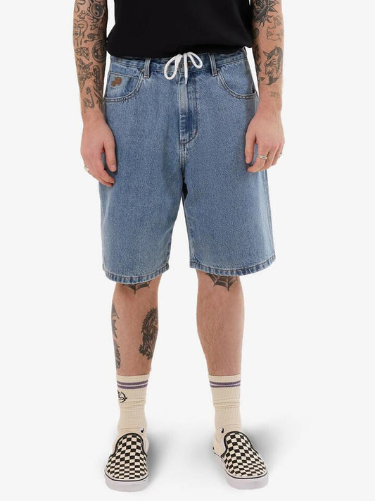 Image of a model wearing Denim. Productname: Worship Going Nuts Big Dawg Jean Short in Rage Blue colour by brand - Worship