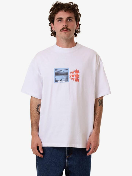 Image of a model wearing Tops. Productname: Thrills Dream Reality Fit Oversize Tee in White colour by brand - Thrills