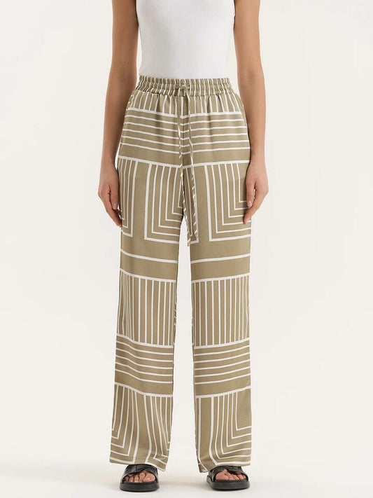 Image of a model wearing Pants. Productname: 4th & Reckless Amira Trouser in Sage Print colour by brand - 4th & Reckless