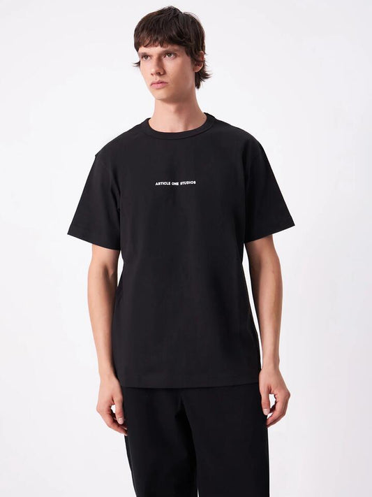 Image of a model wearing Tops. Productname: Article One Everyday Logo Tee in Black colour by brand - Article One