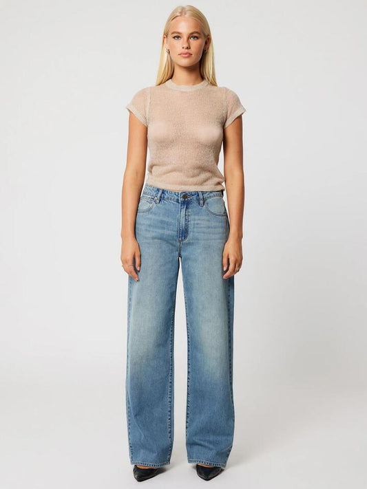 Image of a model wearing Denim. Productname: Abrand 95 Mid Baggy Gisele in Tint Mid Blue colour by brand - Abrand