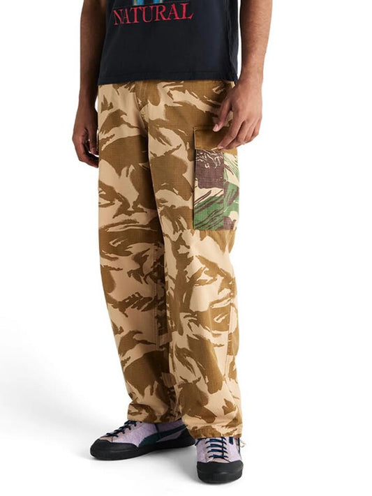 Image of a model wearing Pants. Productname: Deus Arts and Craft Cargo Pant in Humble Crumble colour by brand - Deus