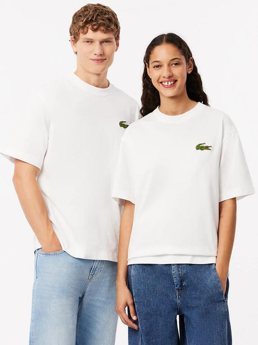 Image of a model wearing Tops. Productname: Lacoste Croc Signature Loose T-Shirt in WHITE colour by brand - Lacoste