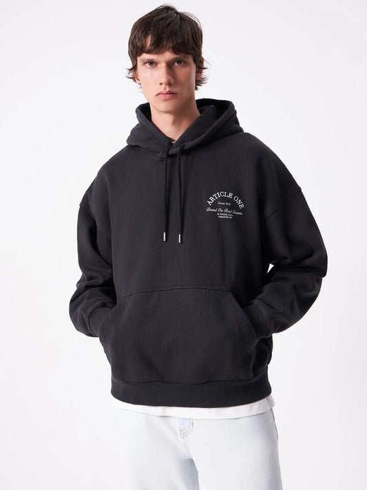 Image of a model wearing Outerwear. Productname: Article One Society Hoodie in Washed Black colour by brand - Article One
