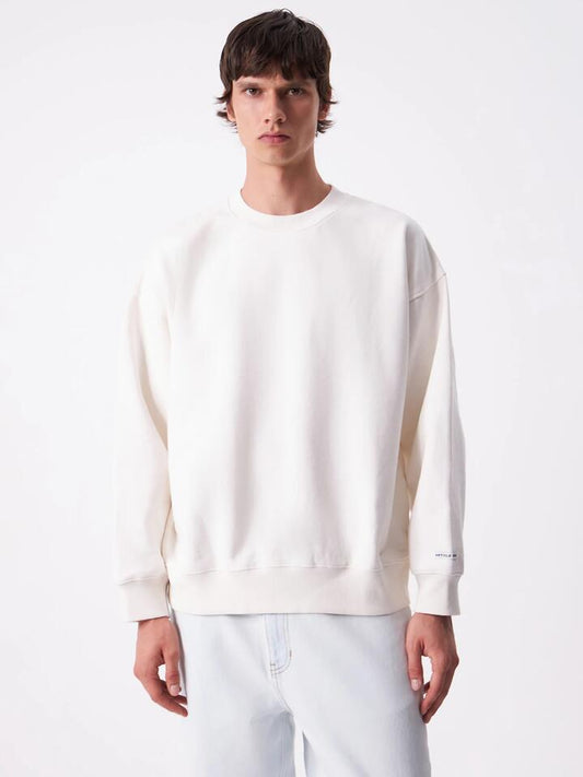 Image of a model wearing Outerwear. Productname: Article One Stevie Boxy Sweatshirt in Chalk colour by brand - Article One