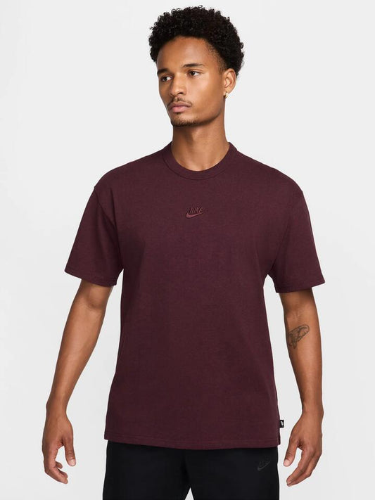 Image of a model wearing Tops. Productname: Nike Premium Essentials T-Shirt in Burgundy Crush/Heather colour by brand - Nike
