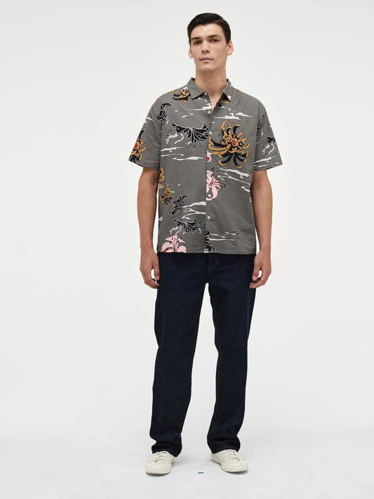 Image of a model wearing Shorts. Productname: Neuw Sativa Print Short Sleeve Shirt in Military colour by brand - Neuw
