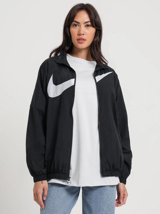 Image of a model wearing Outerwear. Productname: Nike Sportswear Woven Jacket in Black/White colour by brand - Nike