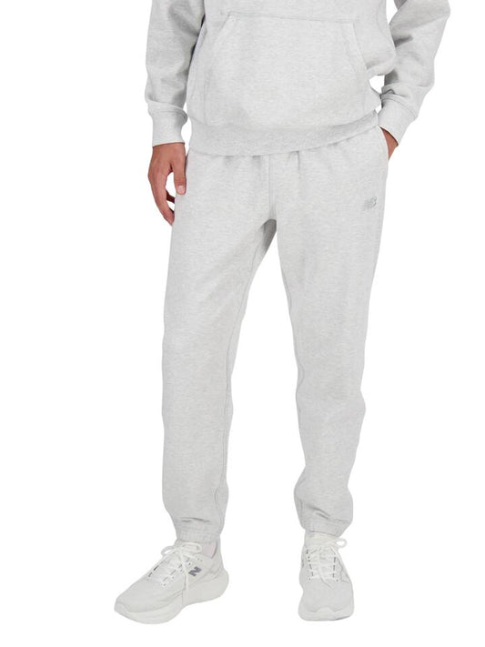 Image of a model wearing Pants. Productname: New Balance Athletics French Terry Jogger in Ash Heather colour by brand - New Balance