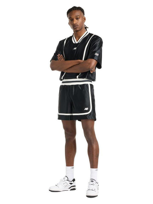 Image of a model wearing Shorts. Productname: New Balance Hoops Knit Short in Black colour by brand - New Balance