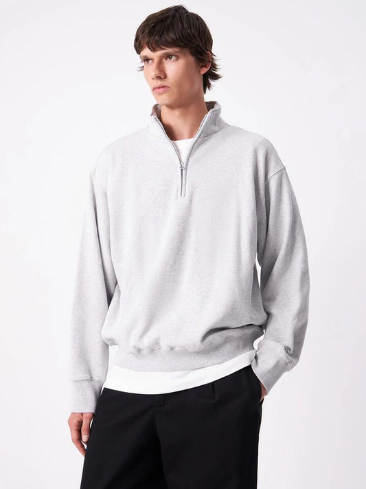 Image of a model wearing Outerwear. Productname: Article One Article Rose 1/4 Zip in Ash Marle colour by brand - Article One